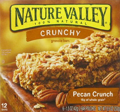 Packaging of Nature Valley Granola Bars with Pecan Crunch flavor, displaying the bar itself along with the '100% Natural' claim and a list of ingredients including pecans and peanuts.